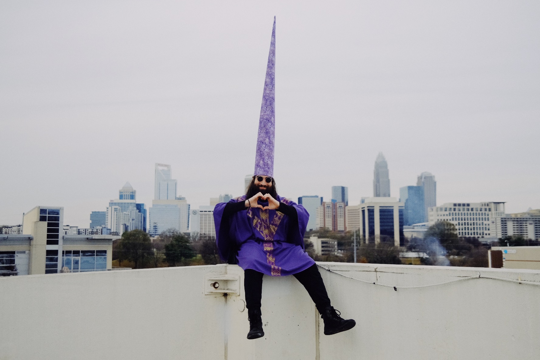 Planet Ruti in a purple wizard hat overlooking the city